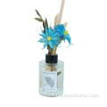 Difusor de canyes d&#39;ampolla rodona amb flors de ram